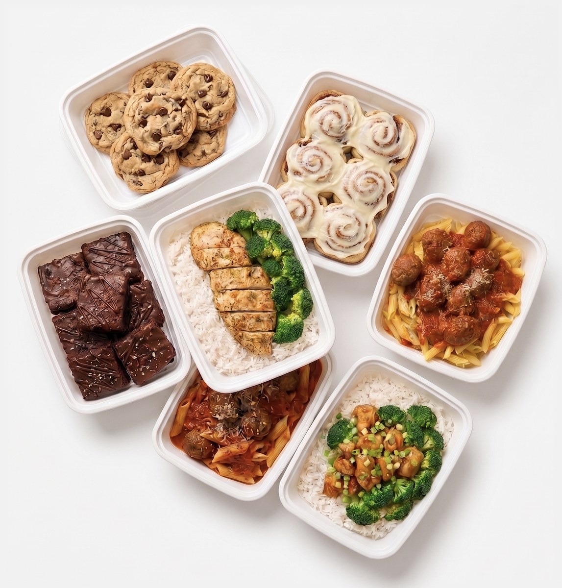 seven tandoco meal-prep containers — chicken + rice + broccoli, pasta + meatballs, orange chicken, brownies, cinnamon rolls, chocolate-chip cookies